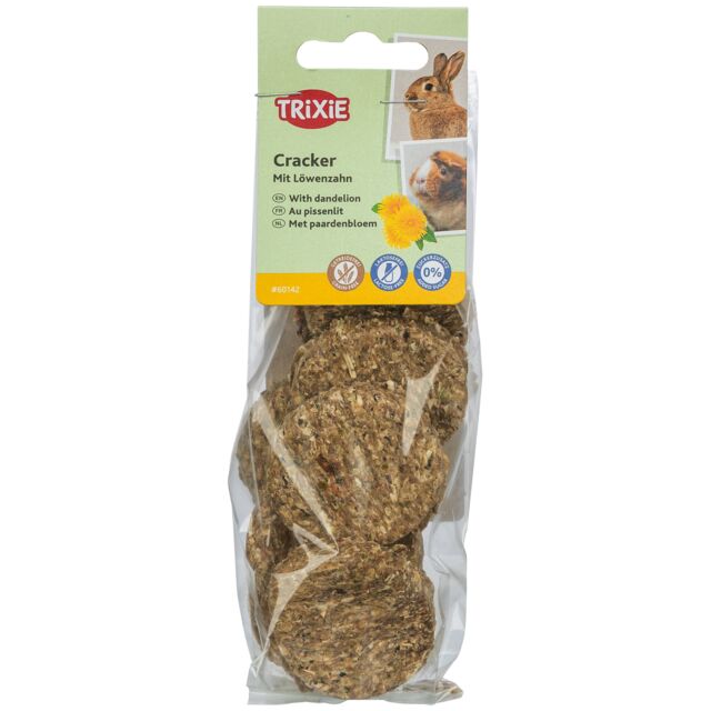 A clear plastic hanging pack of Trixie Grain-Free Dandelion Crackers showing round, compressed herbal discs inside with green and yellow packaging details.